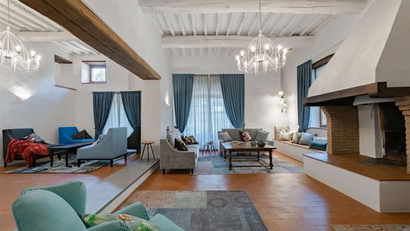 Borgo delle Vigne — the Main Villa's great room, with fireplace and beamed ceiling