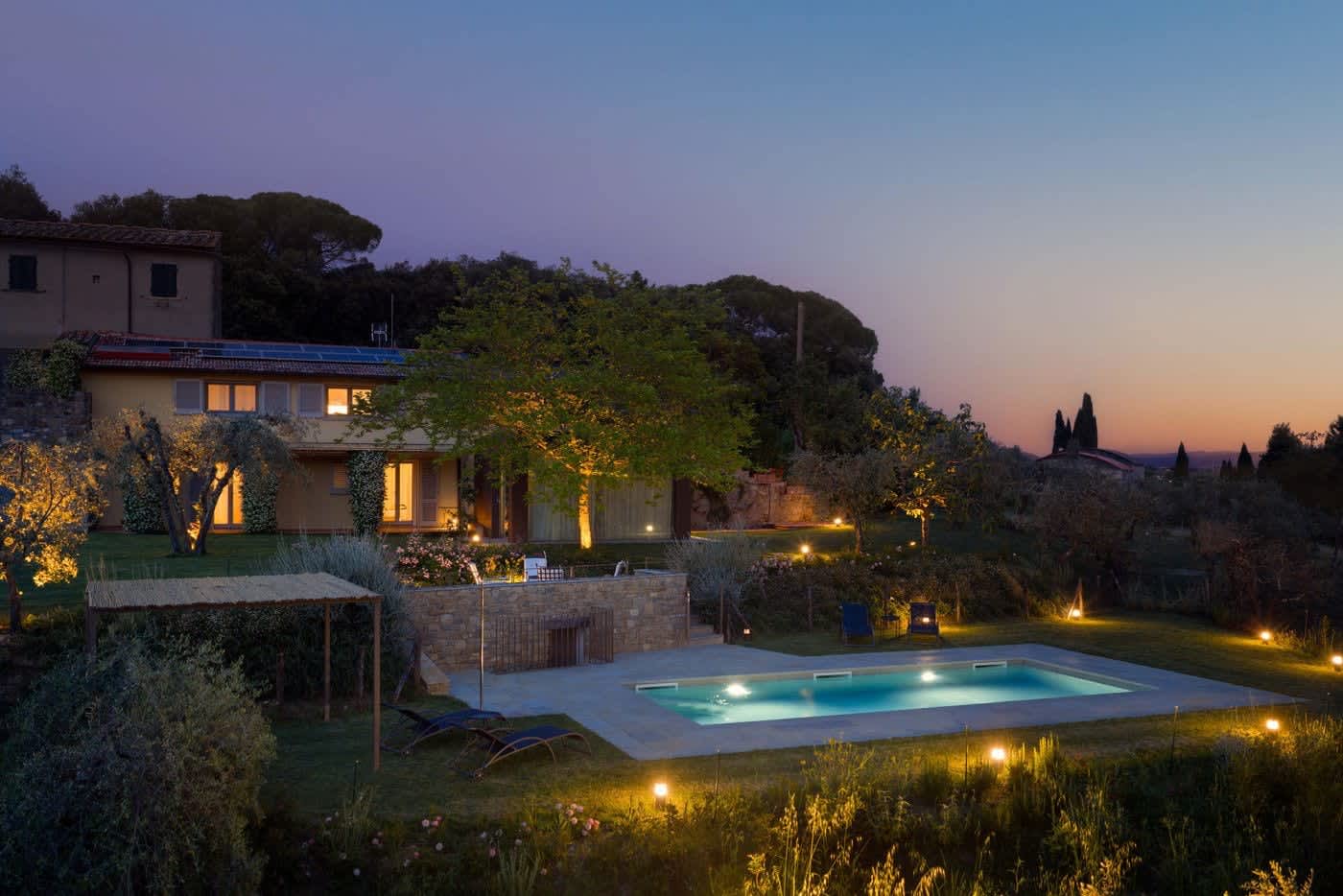 Casa Lilia — the pool lit at dusk