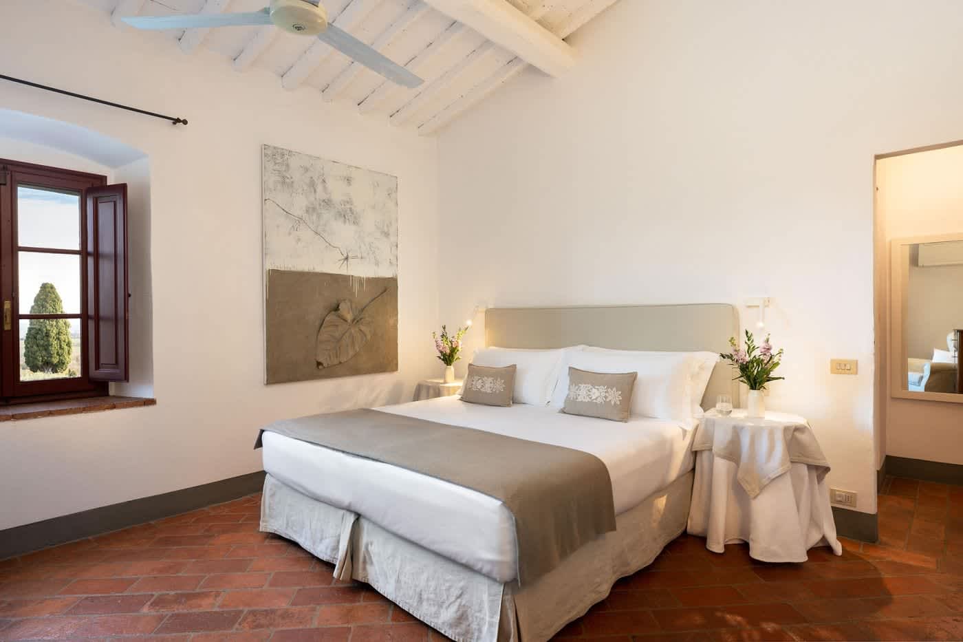 Villa Castellaro — a double bedroom beneath beams