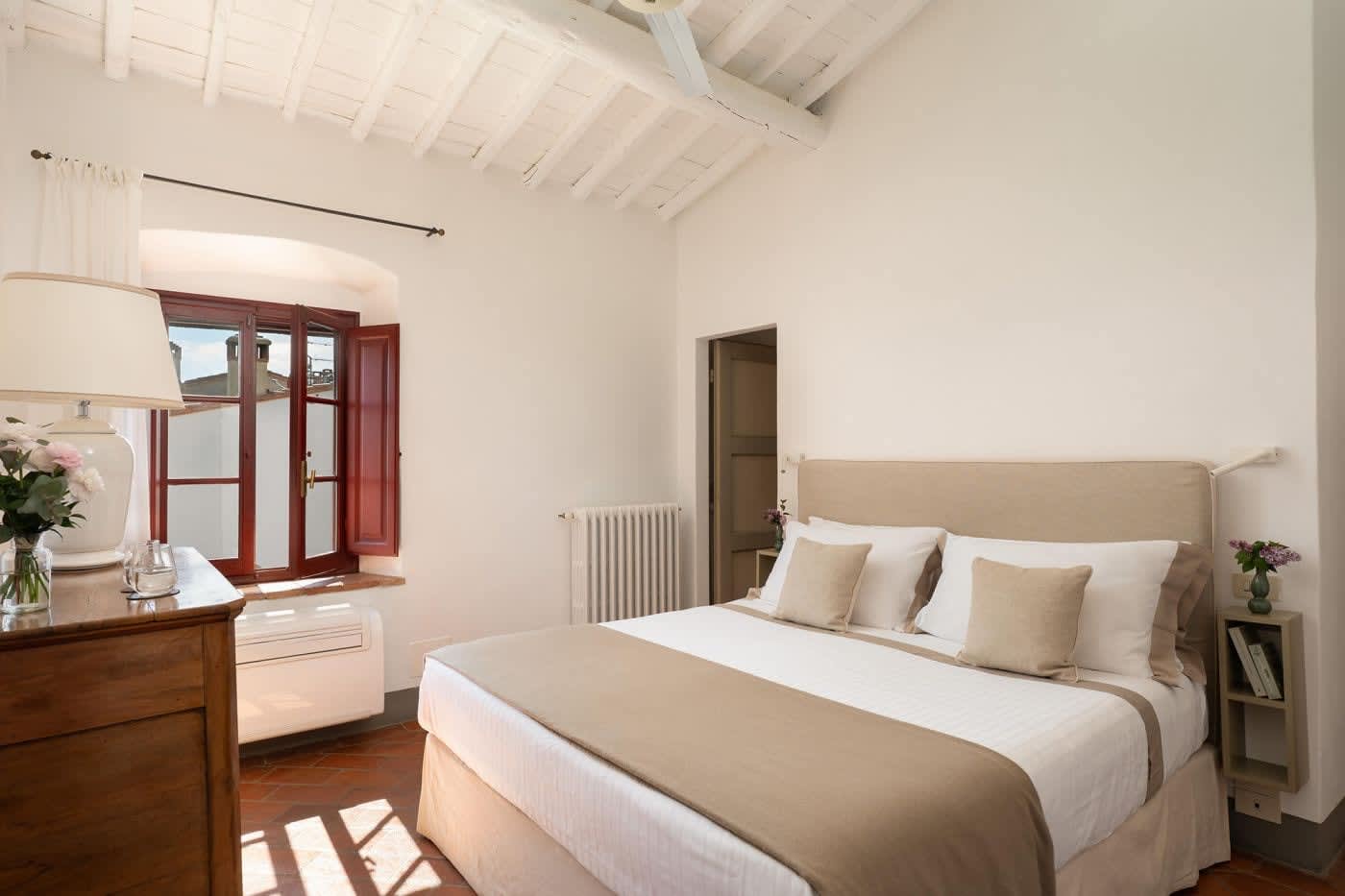 Villa Castellaro — a double bedroom with white linen