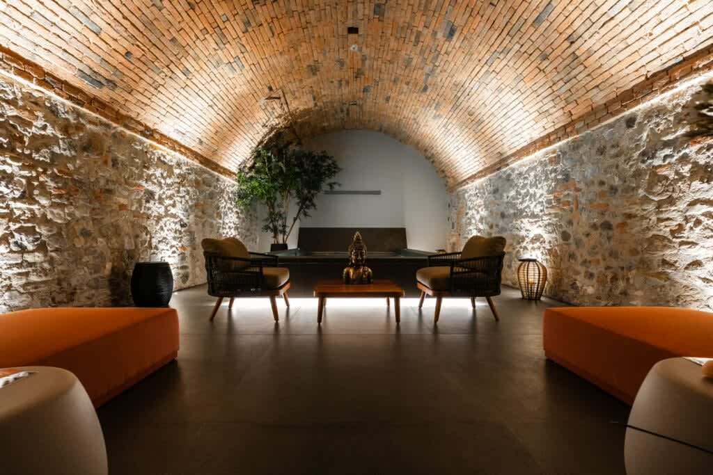 Tenuta Belvedere Estate: Tenuta Belvedere — the vaulted brick wellness lounge