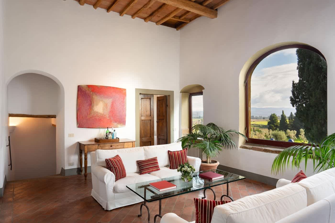 Villa Castellaro — sofas and a glass table in the living room
