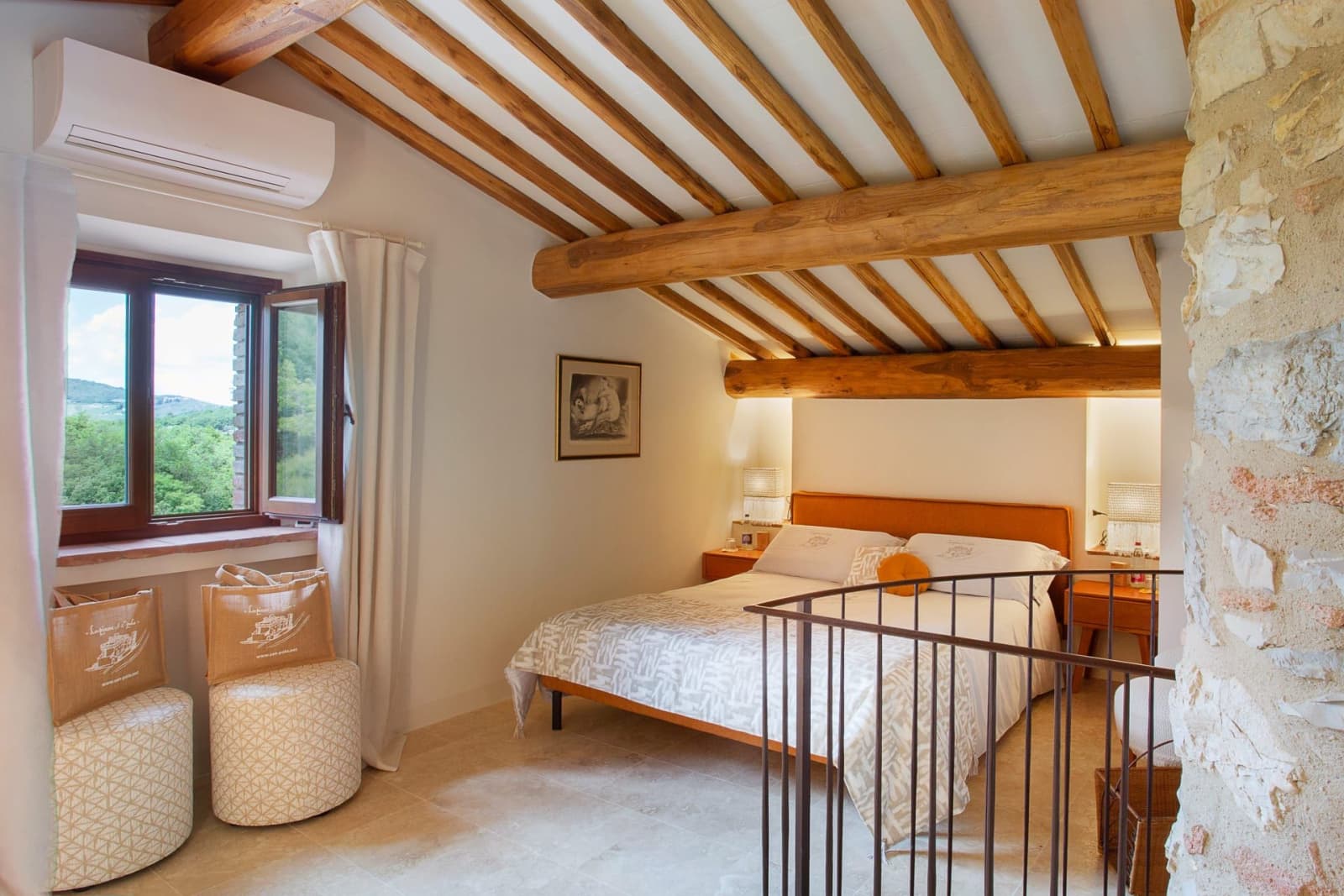 Casa Pernicella — a bedroom under the beams