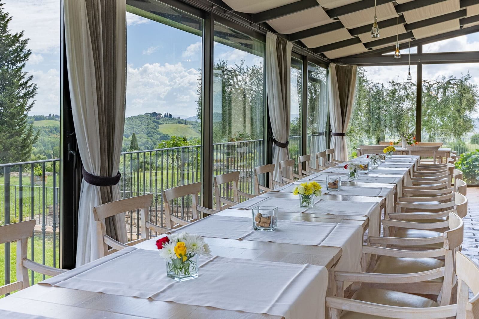 Tenuta La Barricaia — long tables on the veranda, set for a celebration