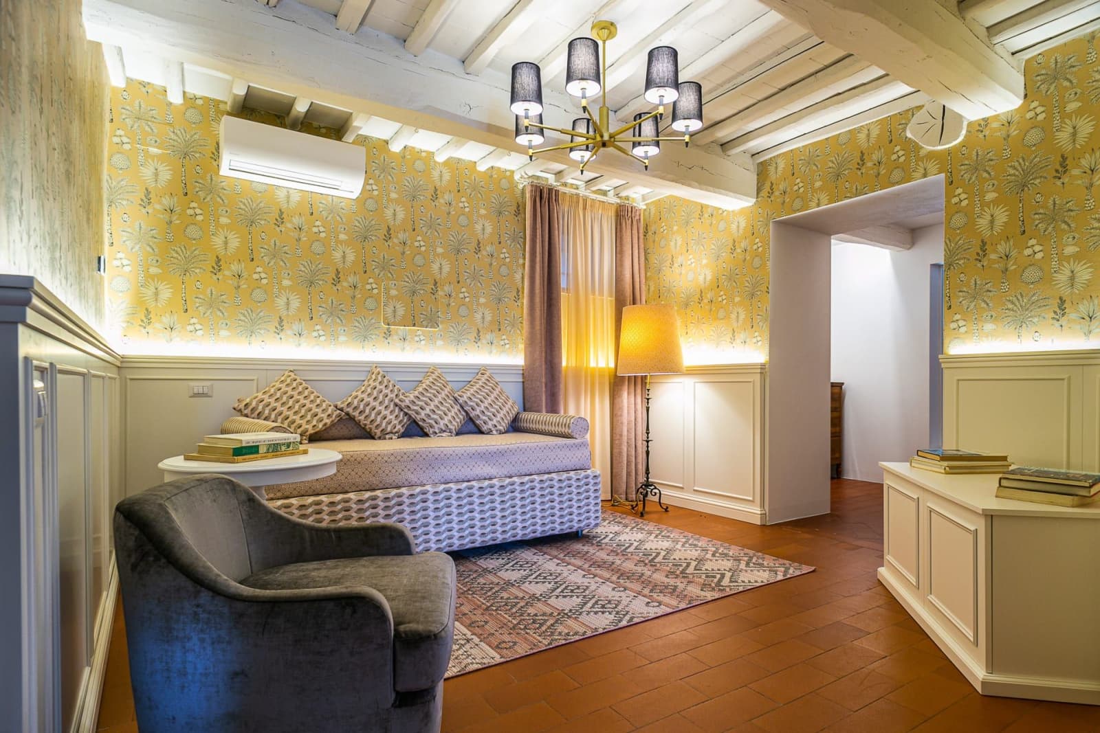 Casa dell'Erta — a bedroom with a chandelier and sofa