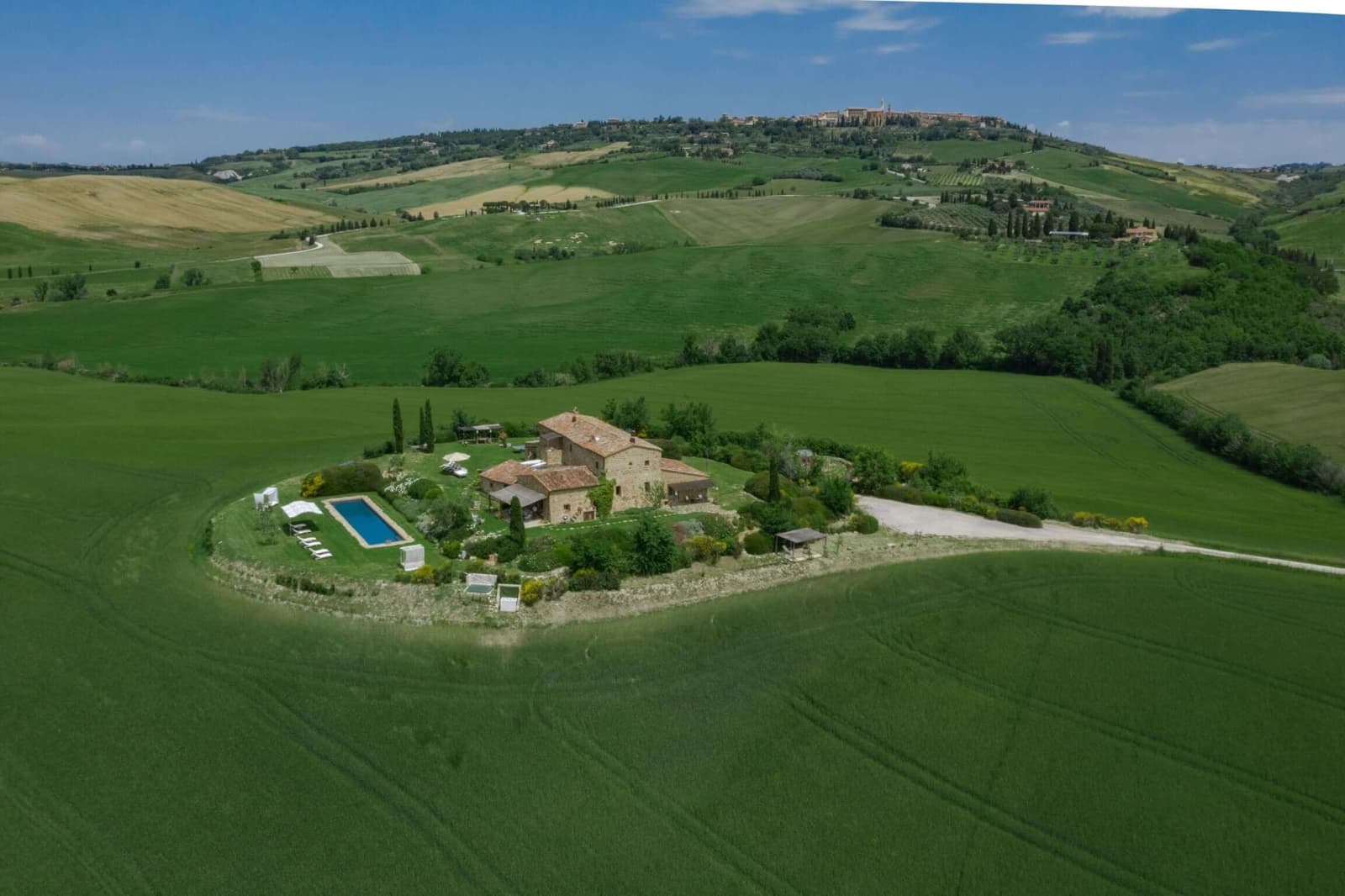 Villa delle Sorelle — the house alone among the green hills, from the air