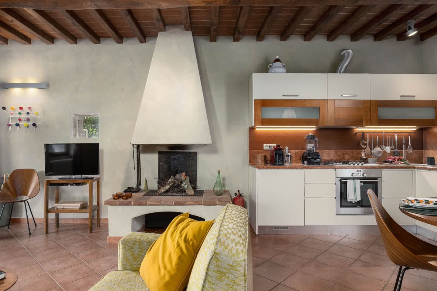 Casale Olivaio — the living room with its fireplace
