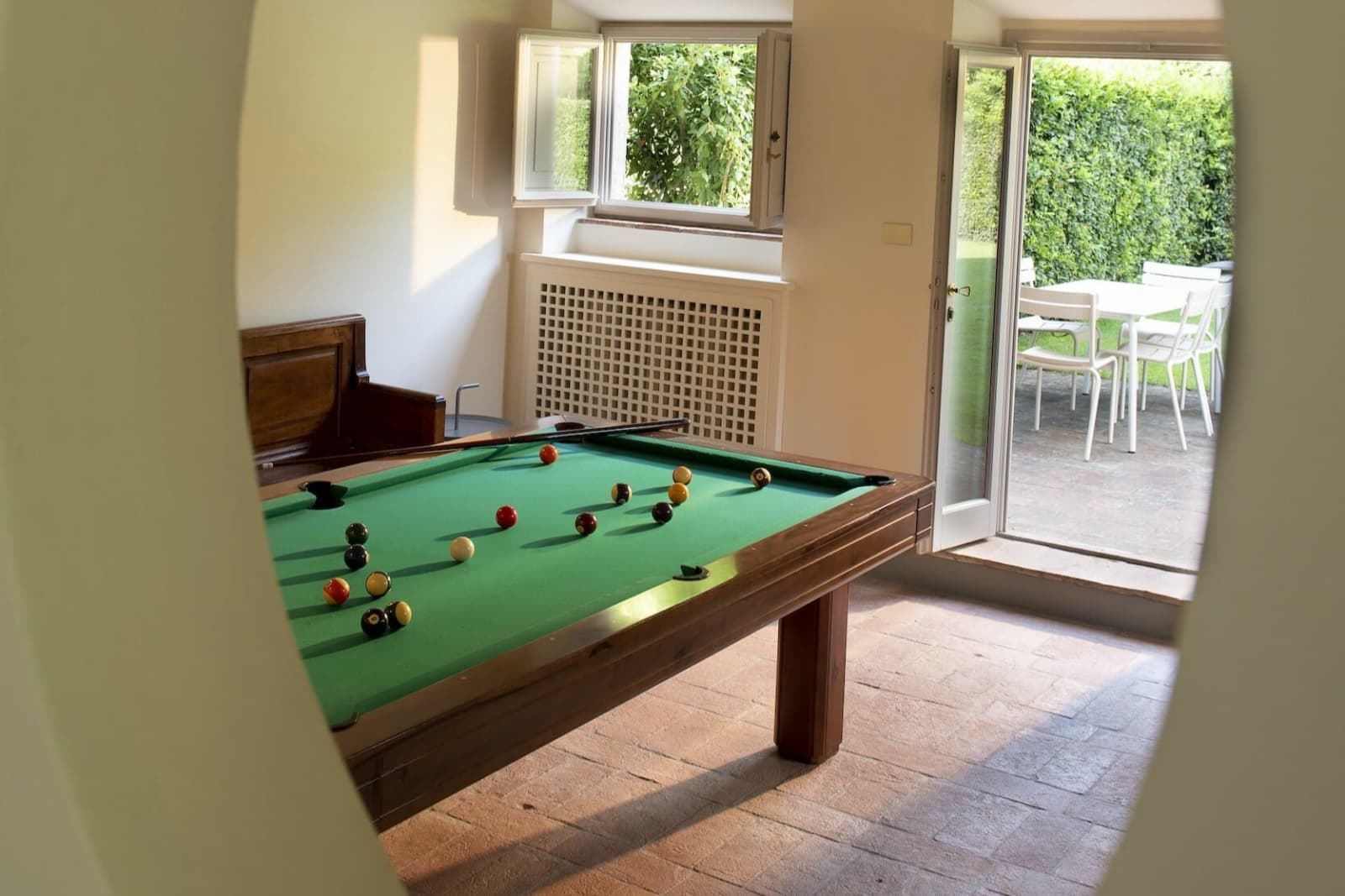 Villa Erbavoglio — the billiards table, viewed through an archway