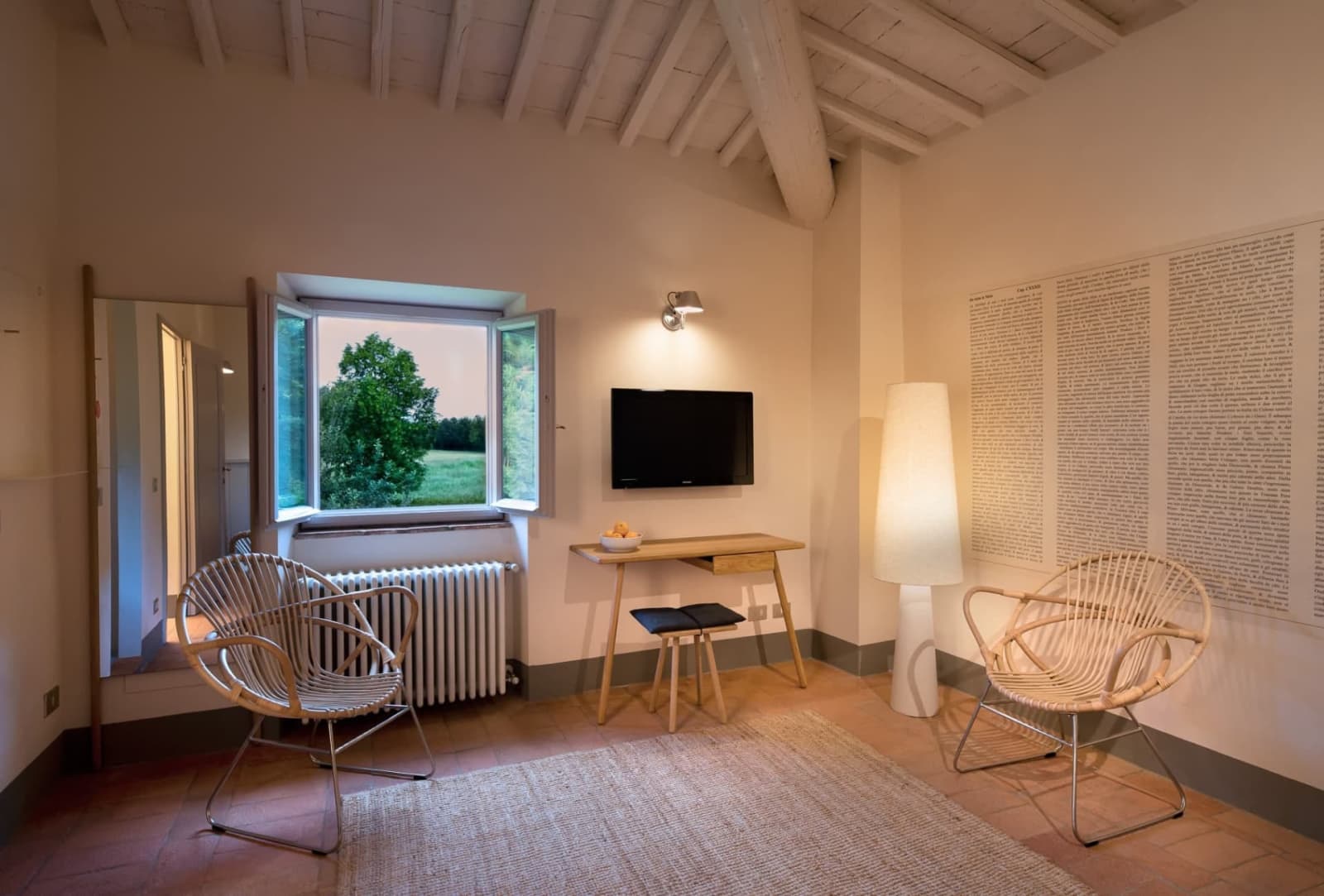 Villa Erbavoglio — a bright bedroom sitting area