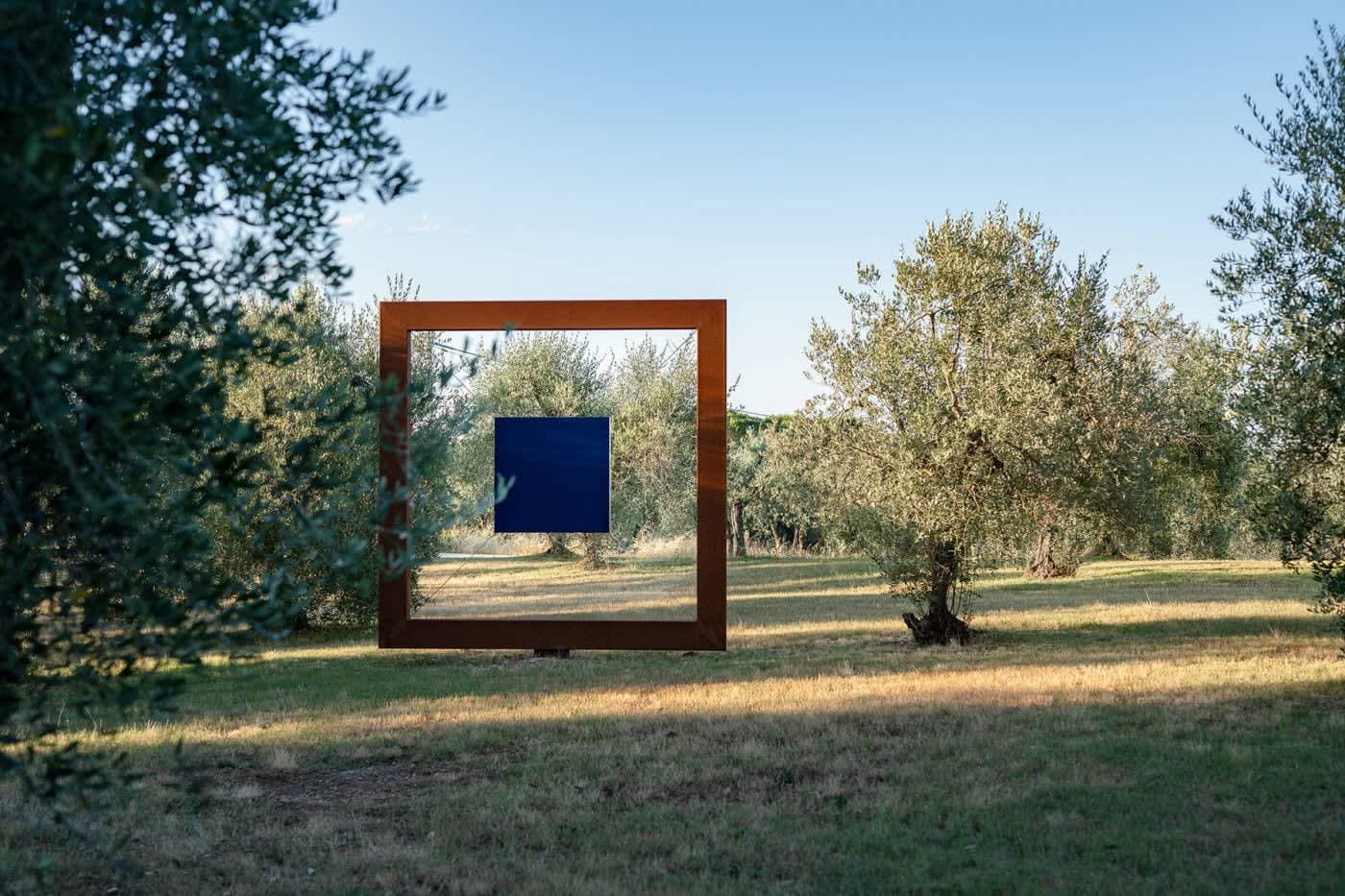Villa Castellaro — a modern sculpture framing the olive grove