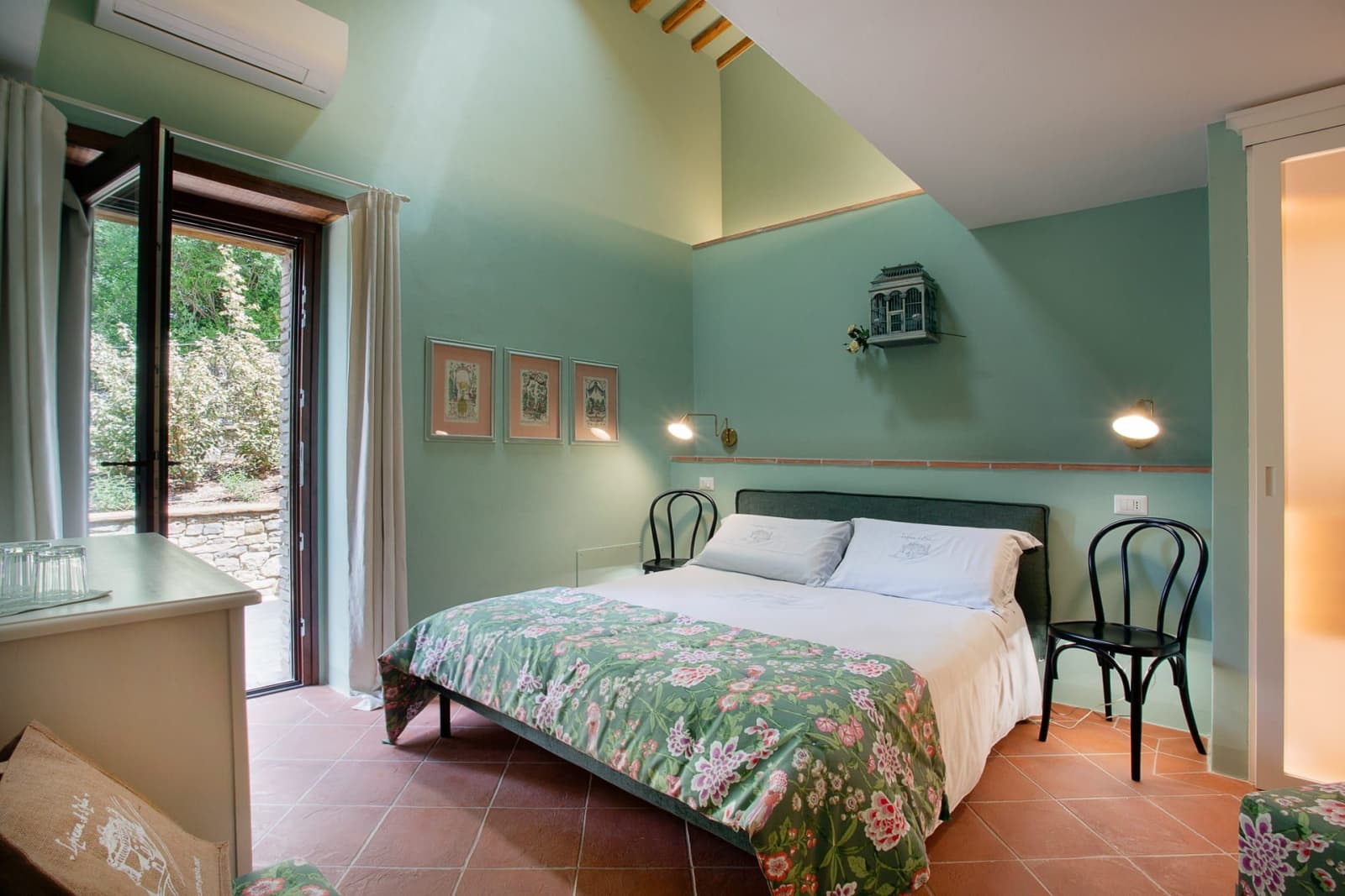 Casa Pernicella — a double bedroom with floral linen