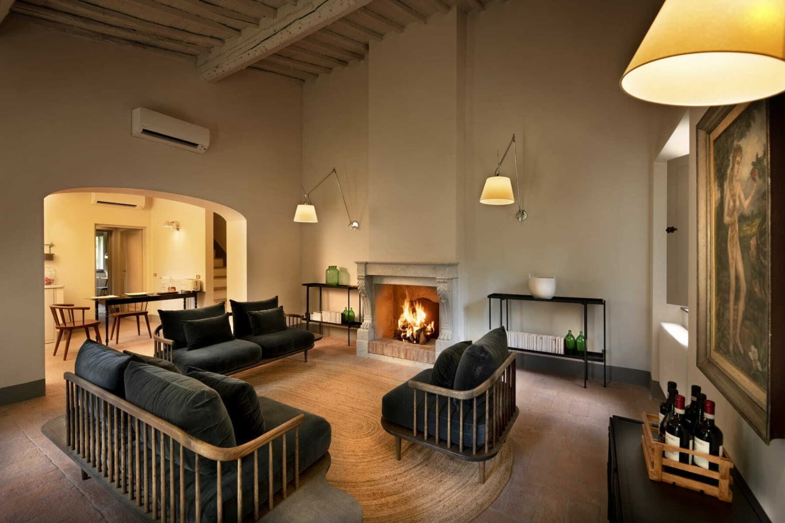 Villa Erbavoglio — a living room with fireplace
