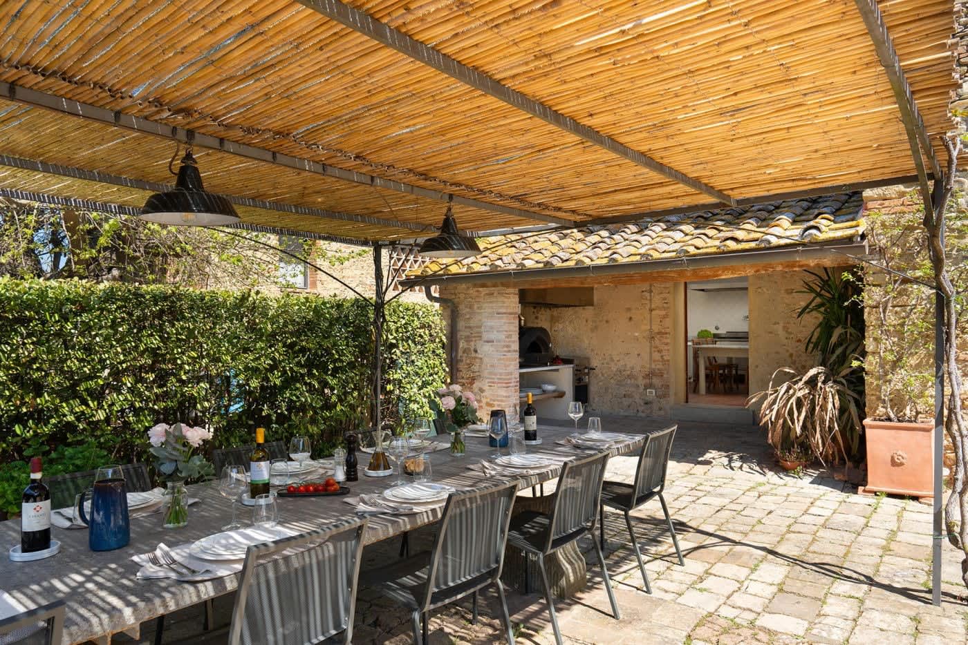 Villa Castellaro — the dining pergola beside the outdoor kitchen