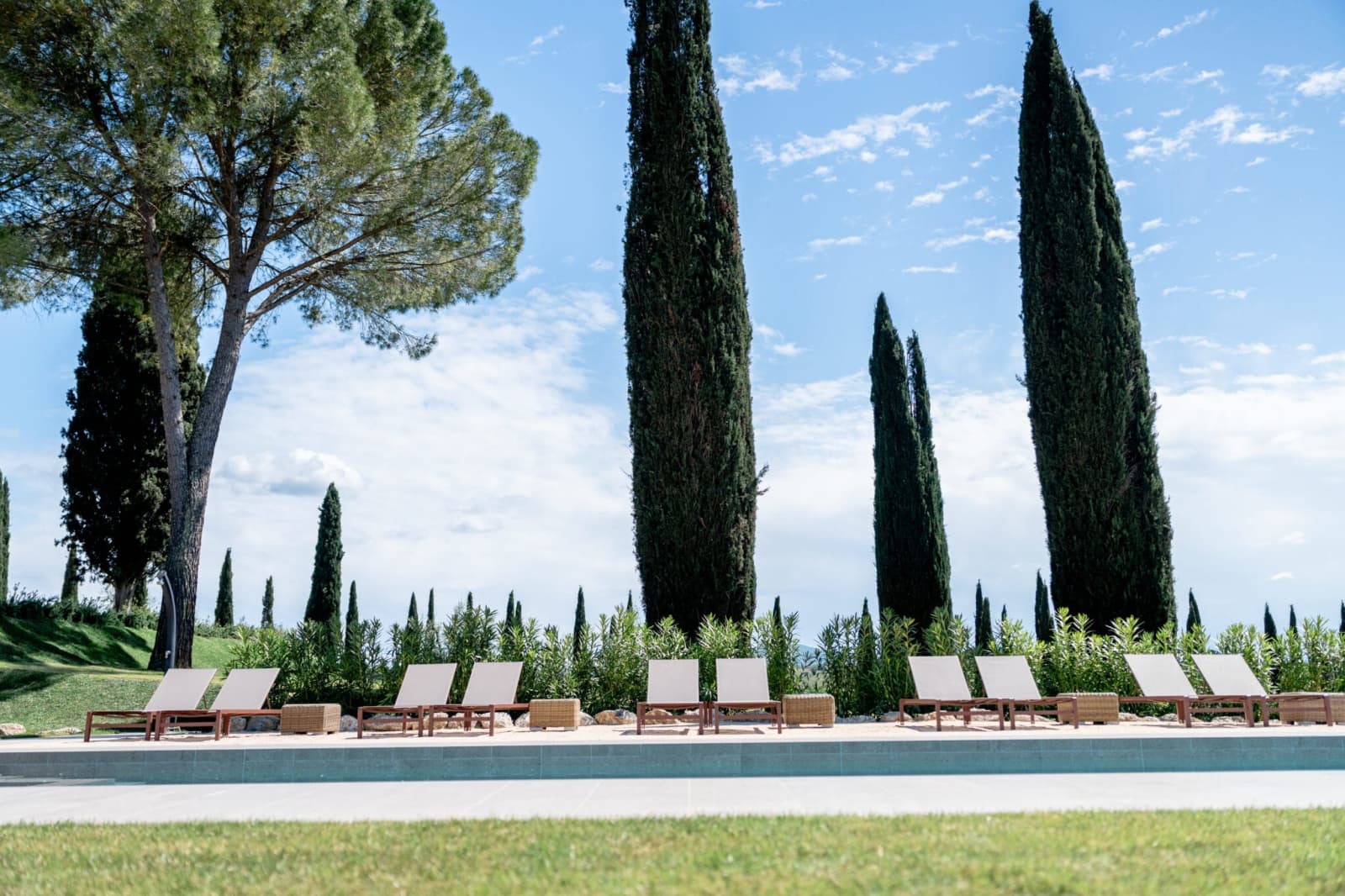 Tenuta Belvedere Estate: Tenuta Belvedere — the pool between the cypresses