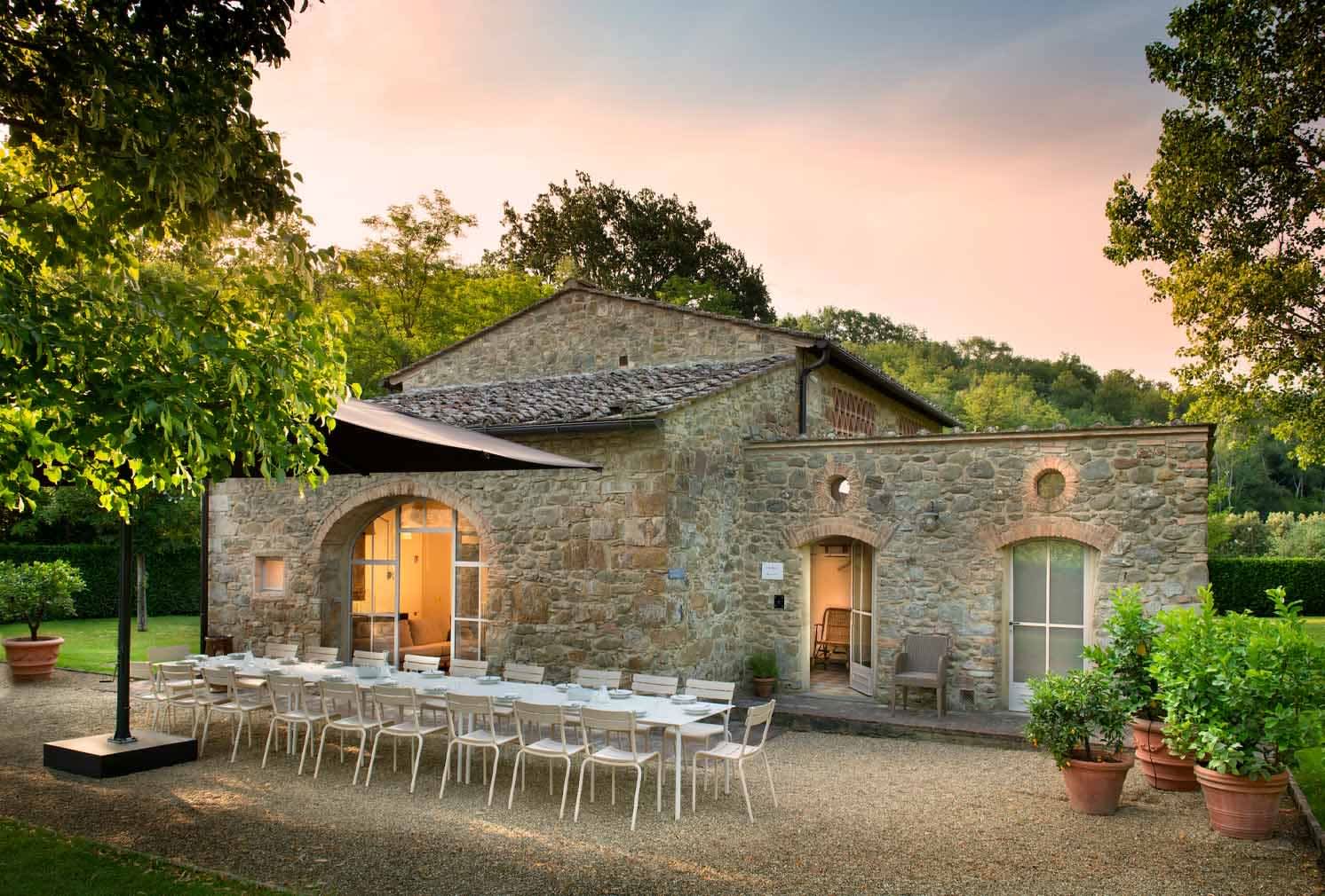 Villa Erbavoglio — the converted stone barn (fienile) and its outdoor dining terrace