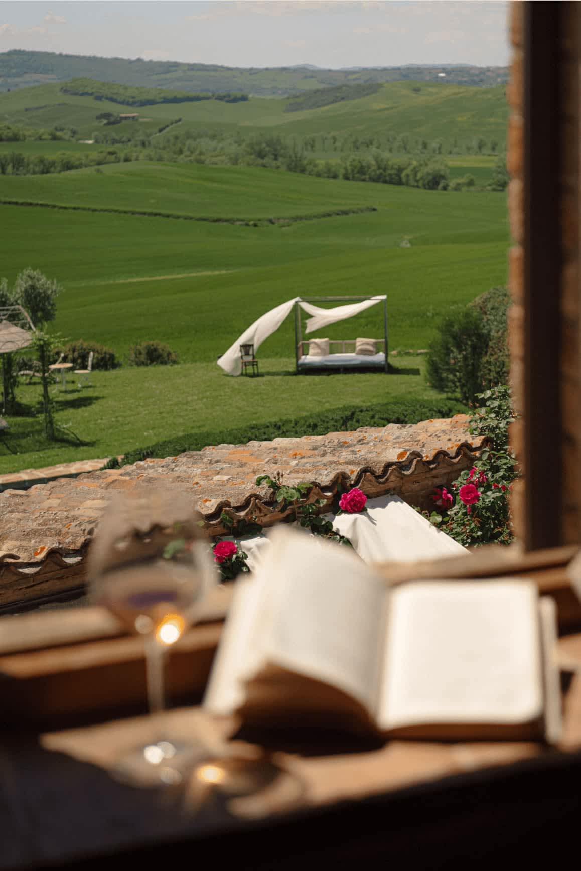 Villa delle Sorelle — a canopy daybed on the lawn