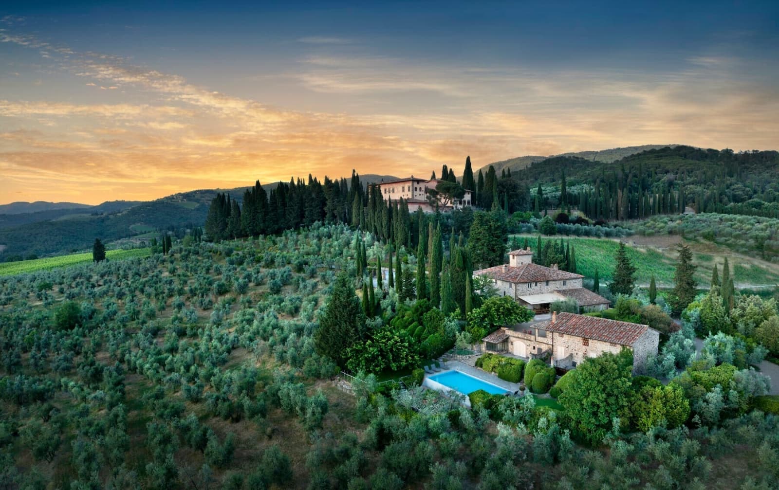 Casale Gherardi — aerial view at sunset, with the pool below