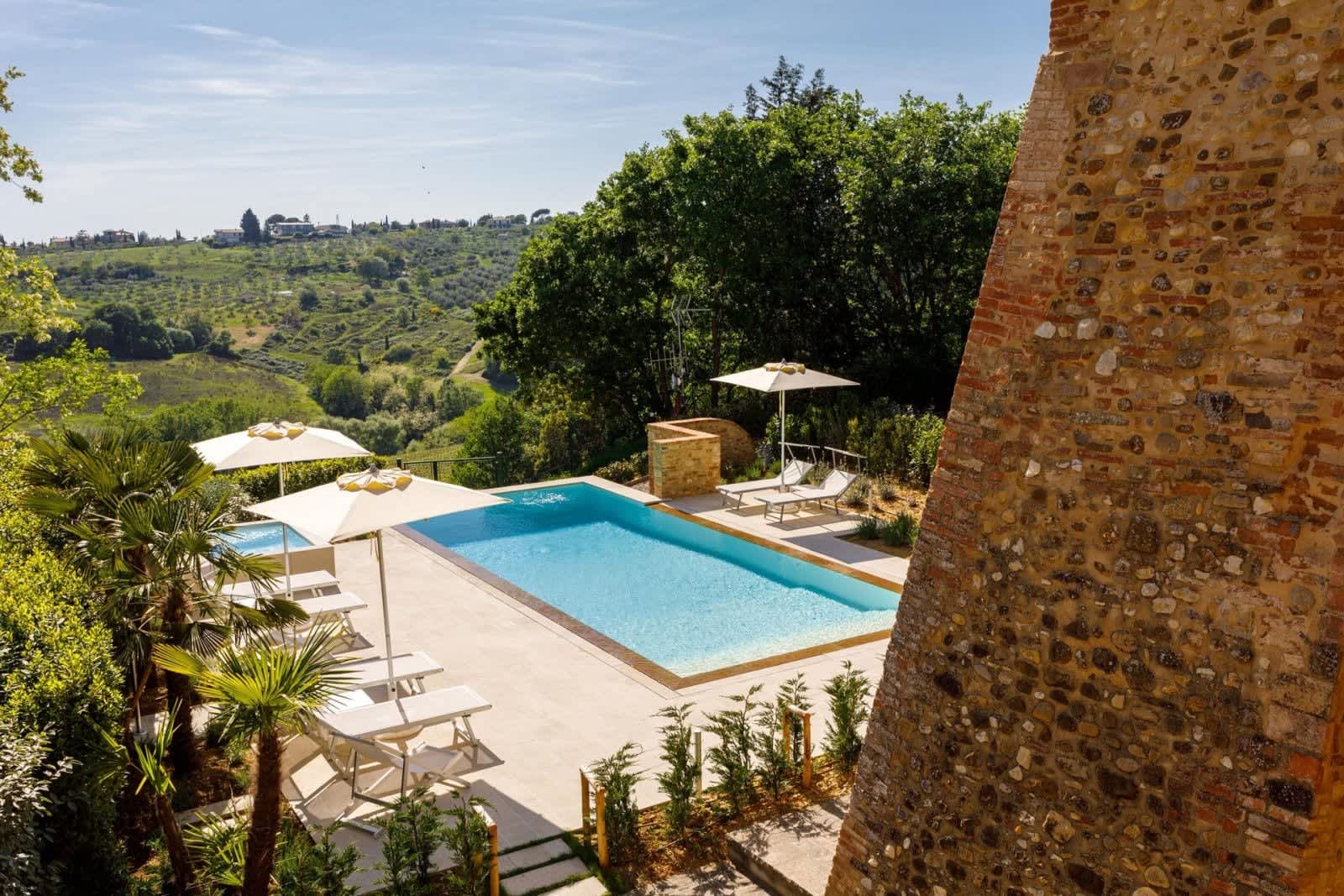 Podere Pianoro — the pool among olive trees