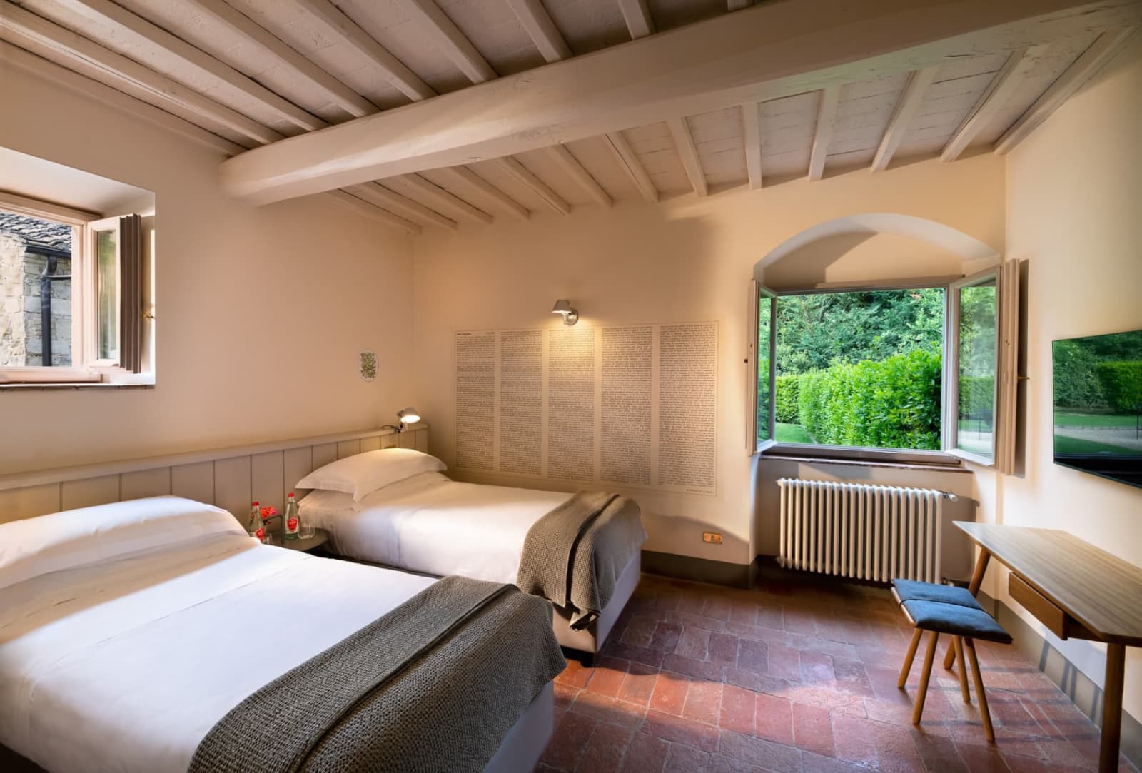 Villa Erbavoglio — a twin bedroom opening onto the garden