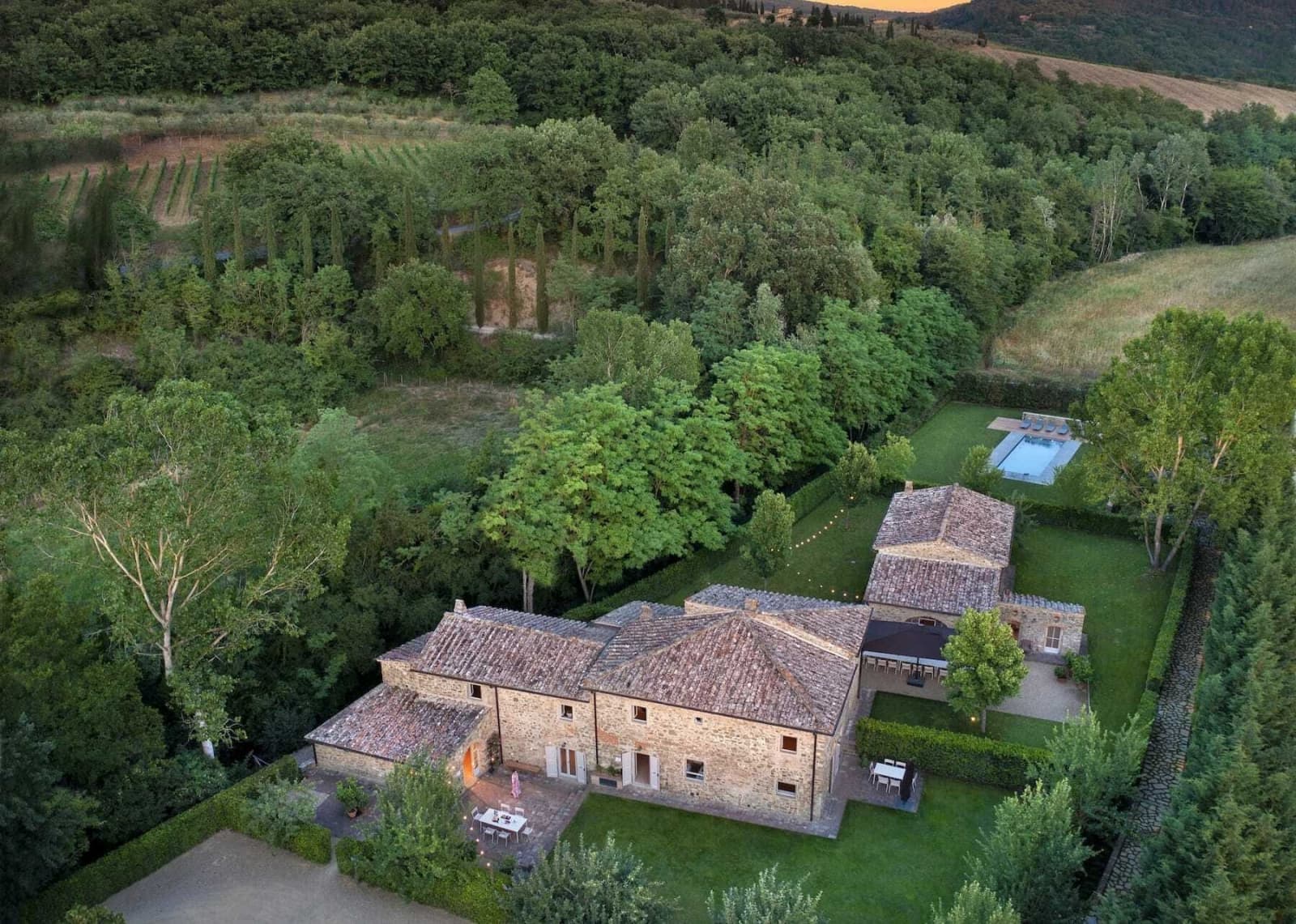 Villa Erbavoglio — aerial view of the two stone farmhouses and grounds