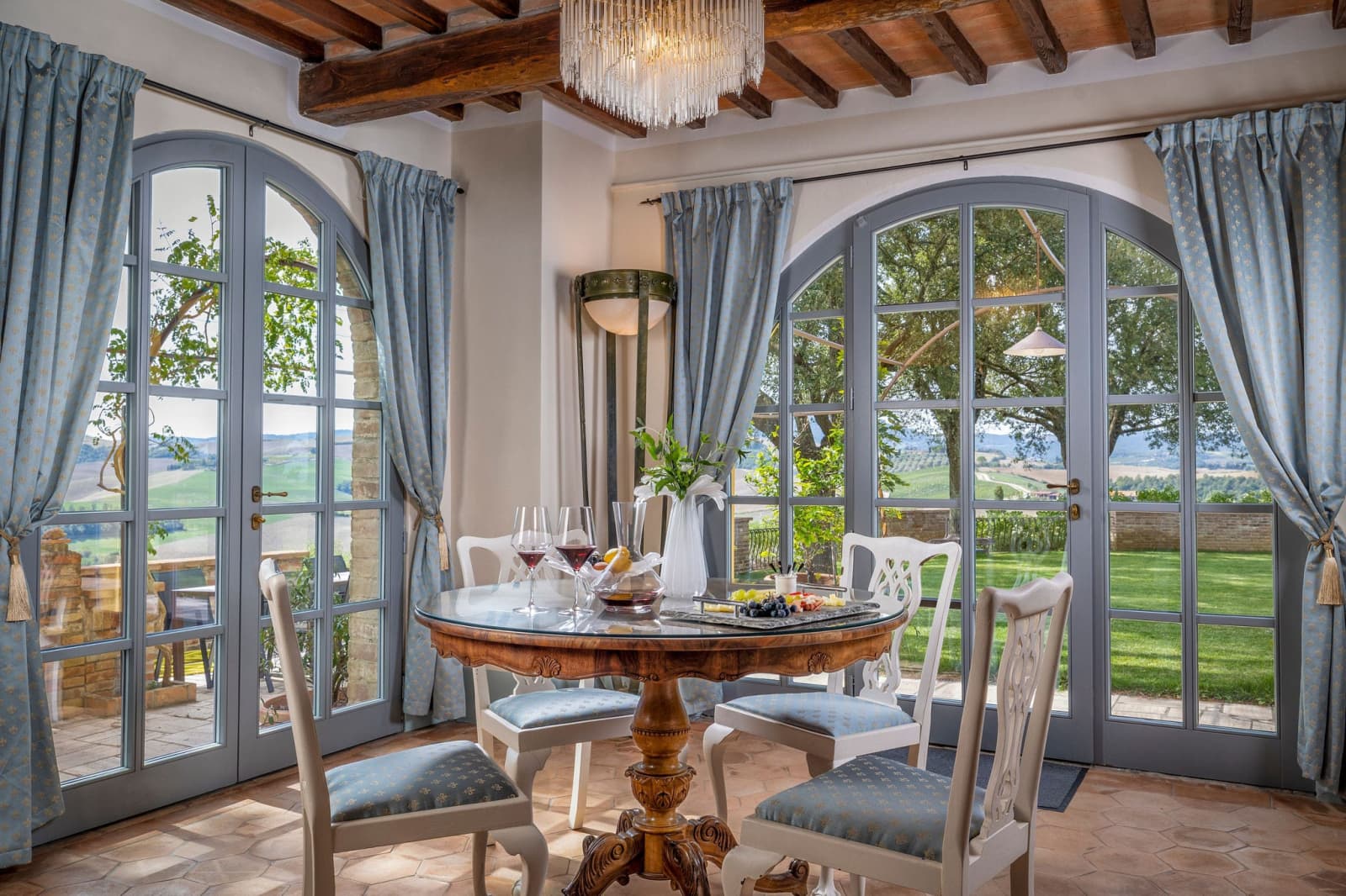 Villa Poggio d'Oro — a suite sitting room with French windows onto the garden