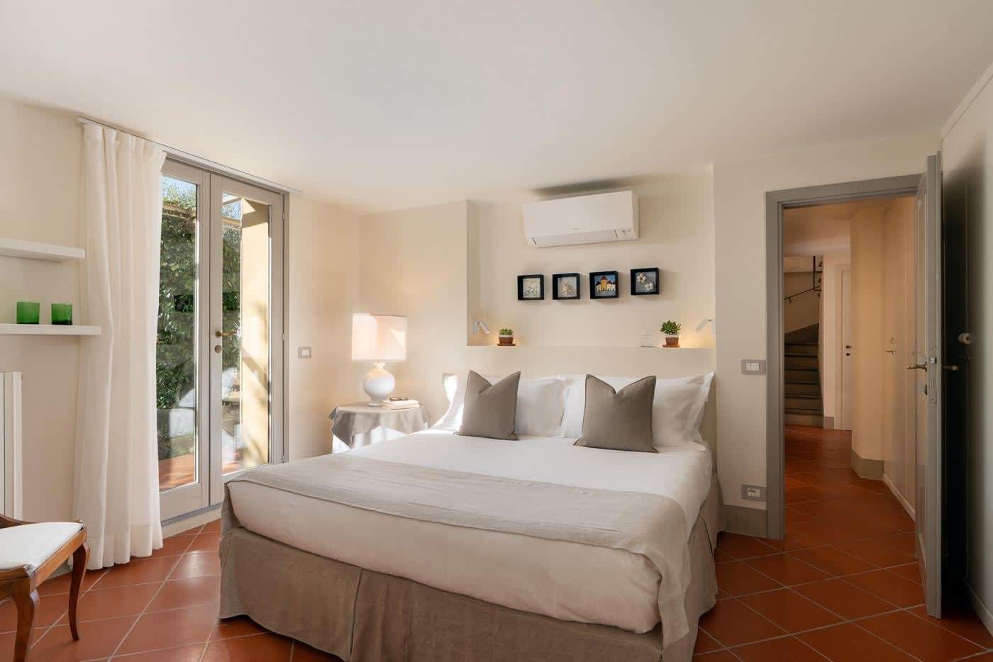 Casa Lilia — a double bedroom in white and stone