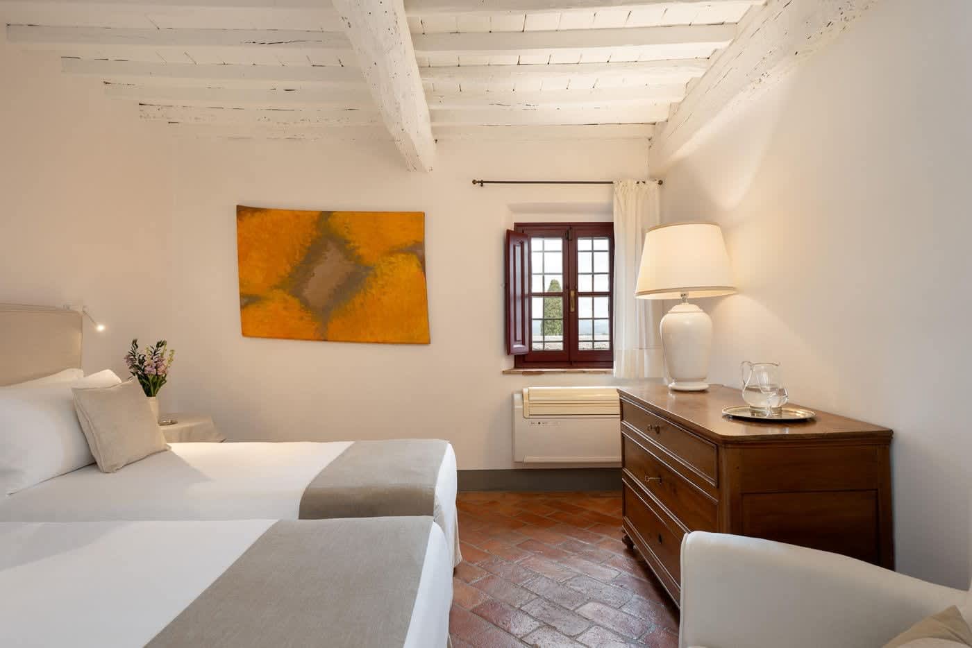 Villa Castellaro — a bedroom with an antique chest
