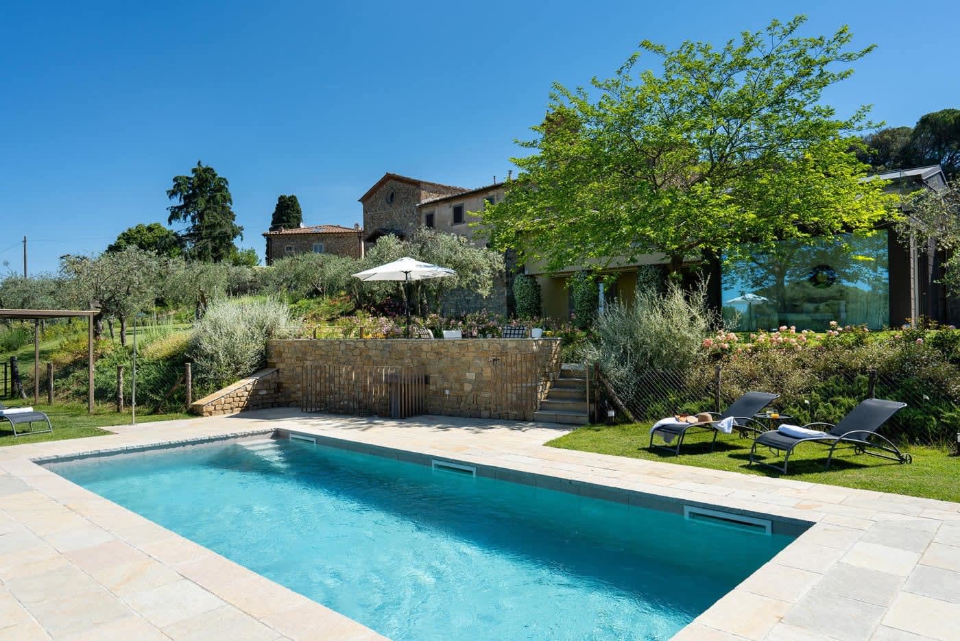Casa Lilia — the pool terrace with the house behind