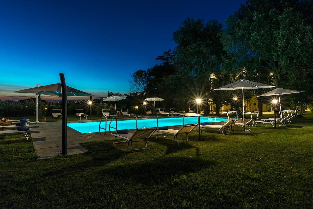 Villa della Cappella — the pool terrace lit up at night