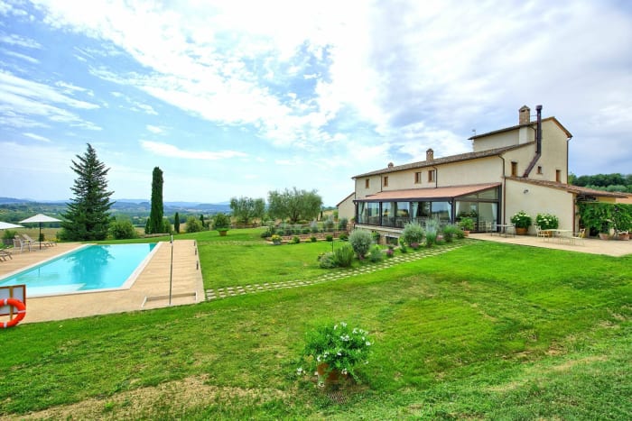 Tenuta La Barricaia — the stone villa above its infinity pool and garden