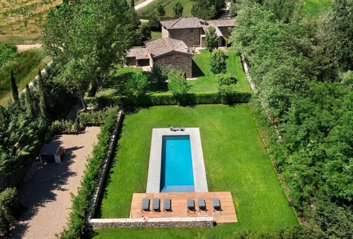 Villa Erbavoglio — a bedroom with beamed ceiling and en-suite bathroom