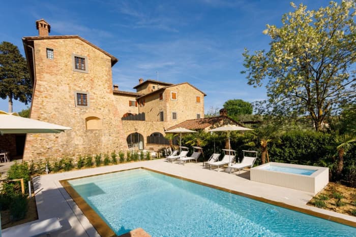 Podere Pianoro — the pool and the stone villa