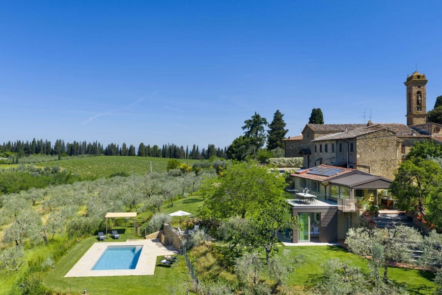 Casa Lilia — the dining table beneath a picture window onto the garden