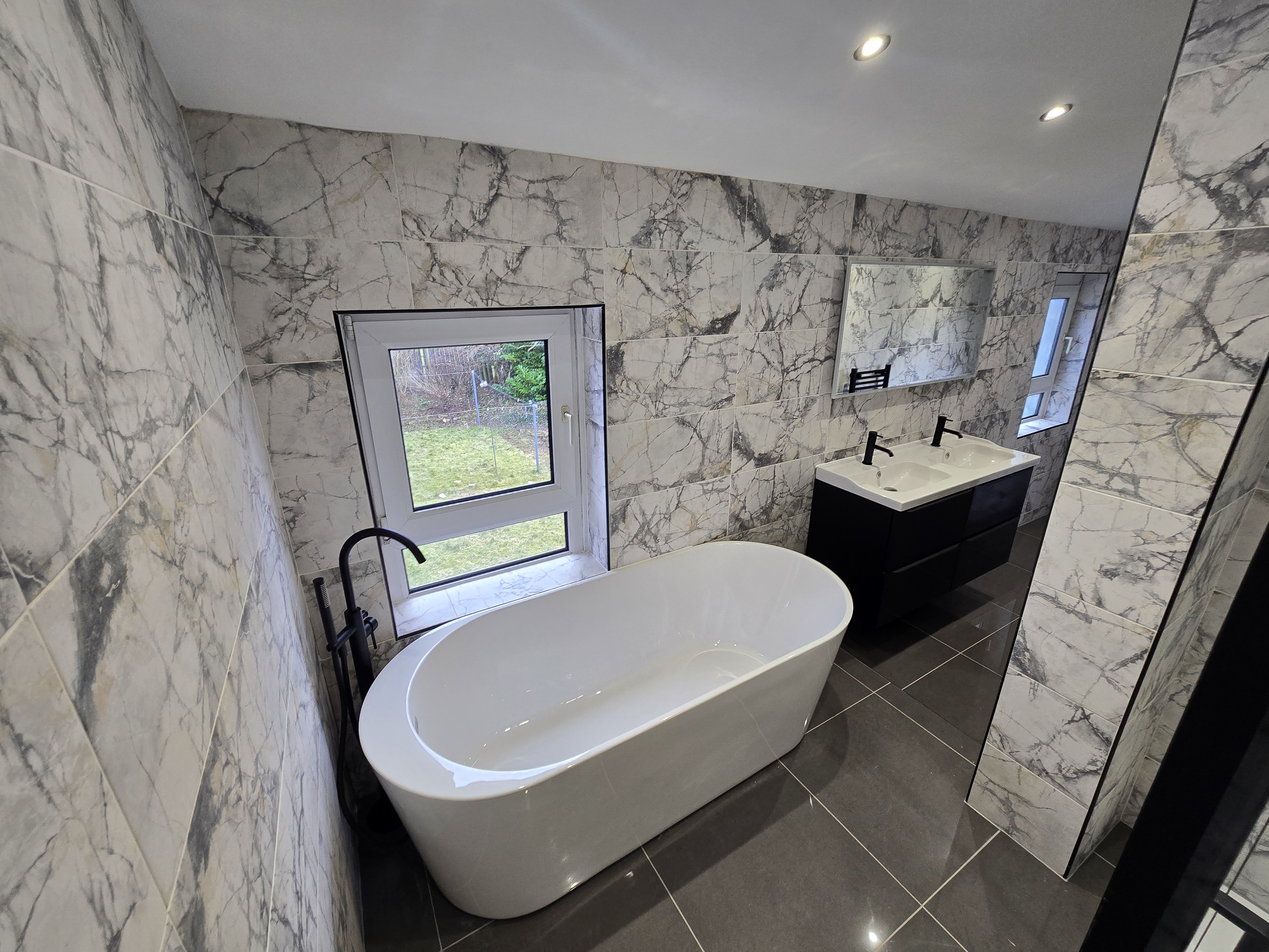 Walk-in shower with black framed glass enclosure — bathroom renovation as part of full flat refurbishment, Wishaw North Lanarkshire