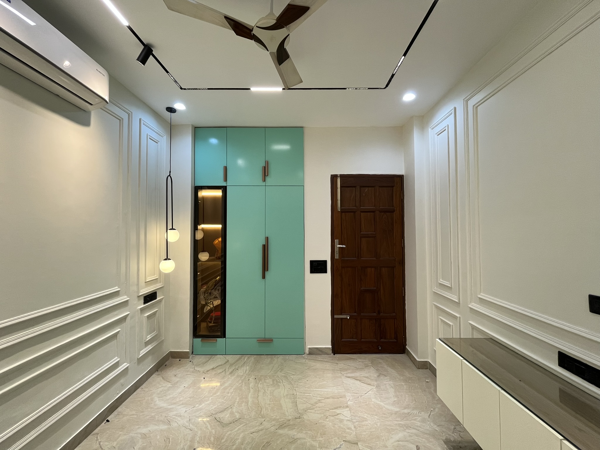 Beautiful bathroom interior design with modern fixtures and elegant tile work by OneColor Interiors