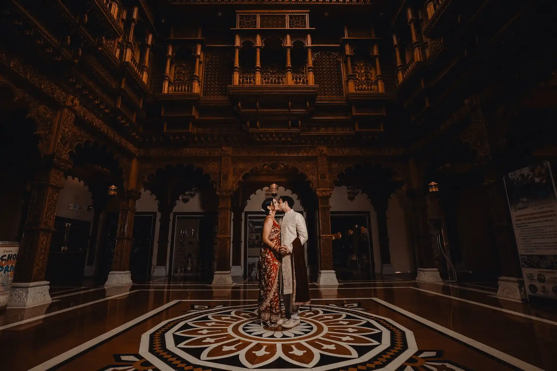 bride and groom in traditional Indian garments celebrating Hindu ceremony at BAPS temple
