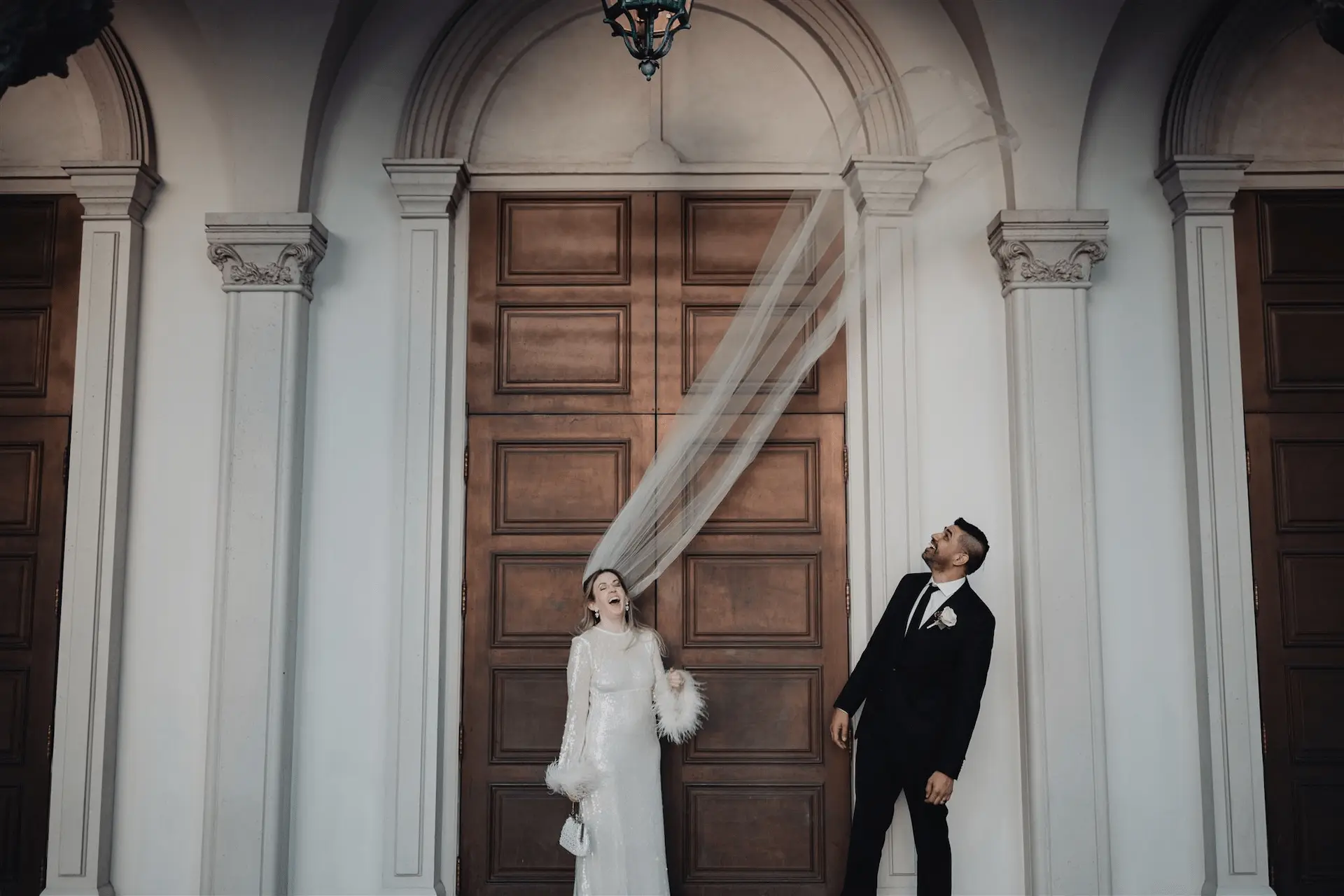 Photograph of wedding day bride and groom veil by los angeles wedding photographer in L