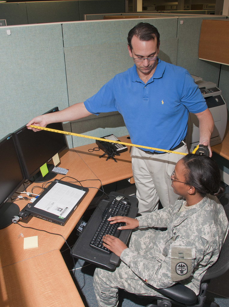 Man assessing ergonomics