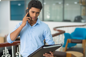 Man discussing over the phone about work