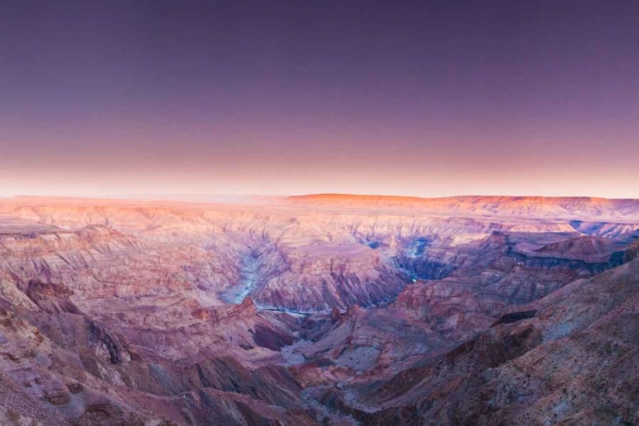 The Fish River Canyon under a pink dusk sky at Hobas