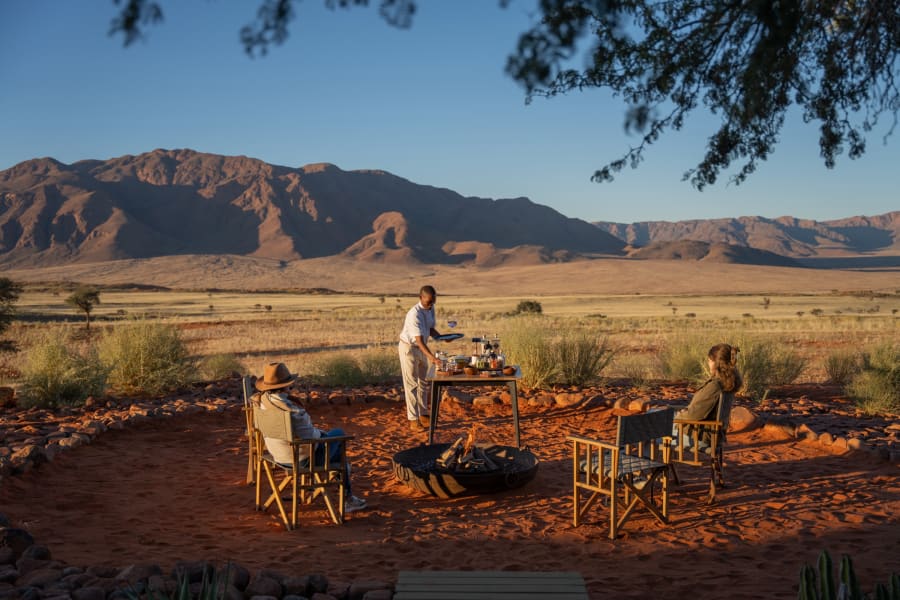 Coffee on the red sand below the NamibRand mountains at Wolwedans