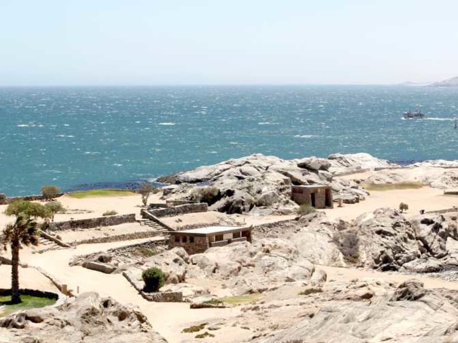 A campsite among granite rocks beside the sea