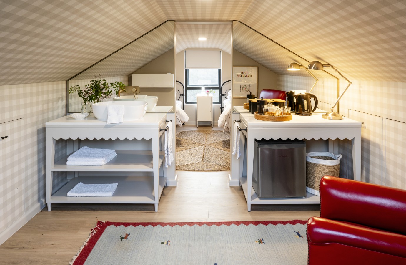 The attic under the pitched roof, with basin and coffee station