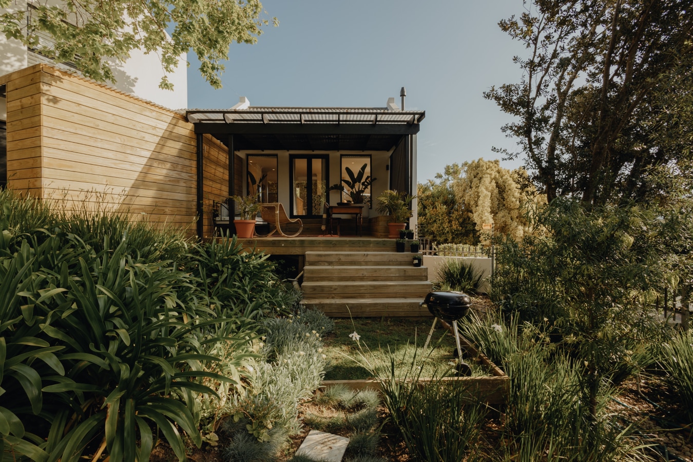 The cottage from the garden, with the braai on the path