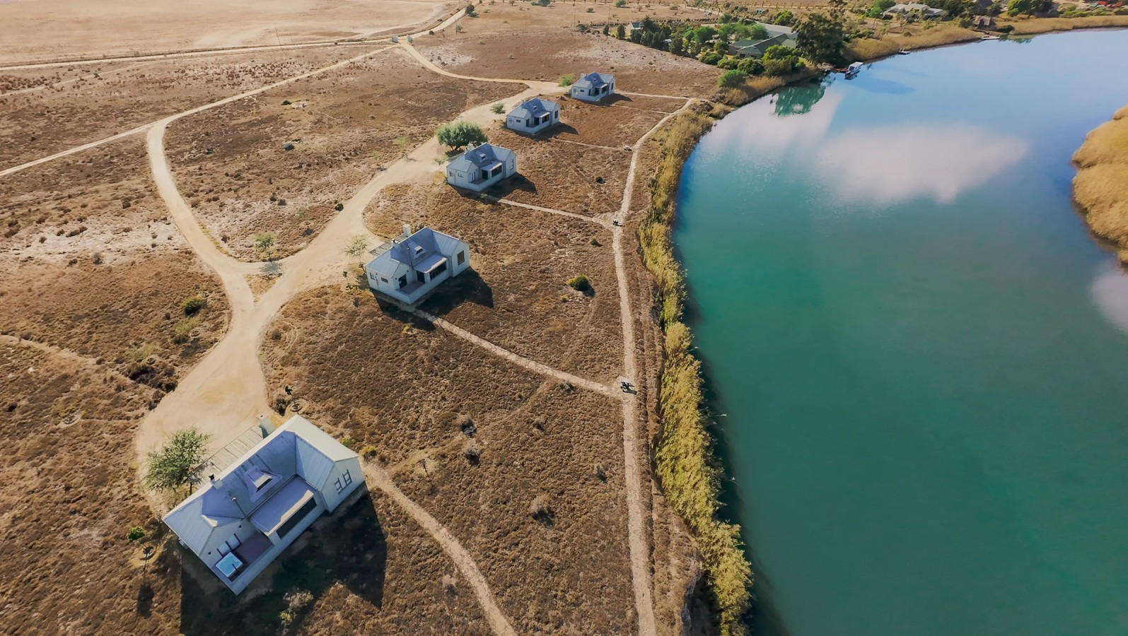 Aerial view of Quagga River Lodge chalets beside the Berg River