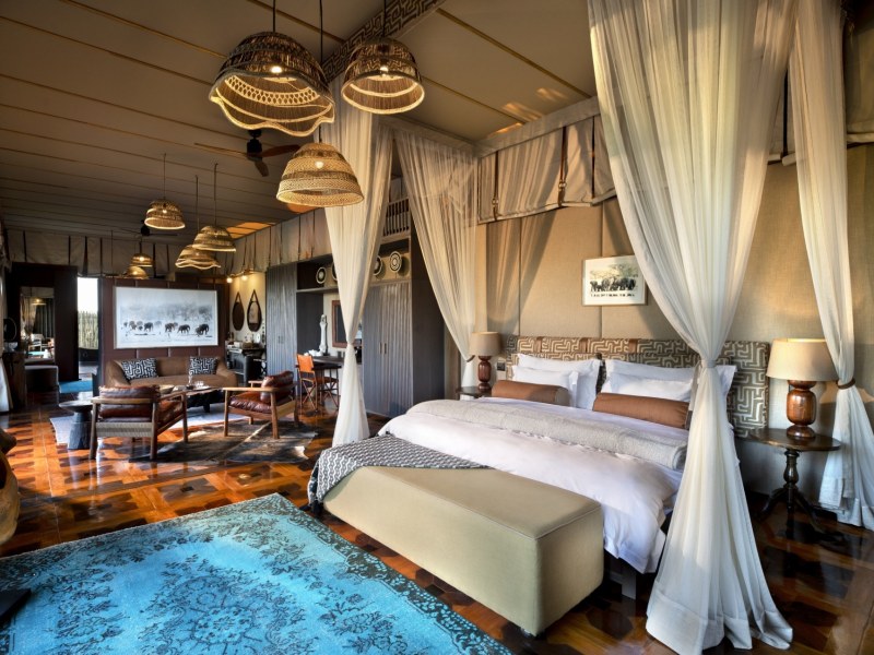a luxurious bedroom in the okavango delta, Atzaró Okavango Camp