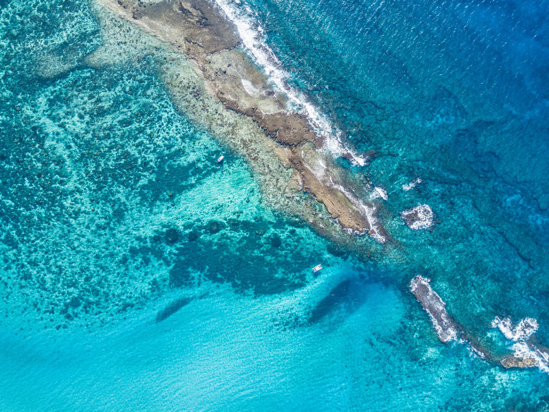 Azura Benguerra Island, Aerial view of clear blue waters Scott Ramsay