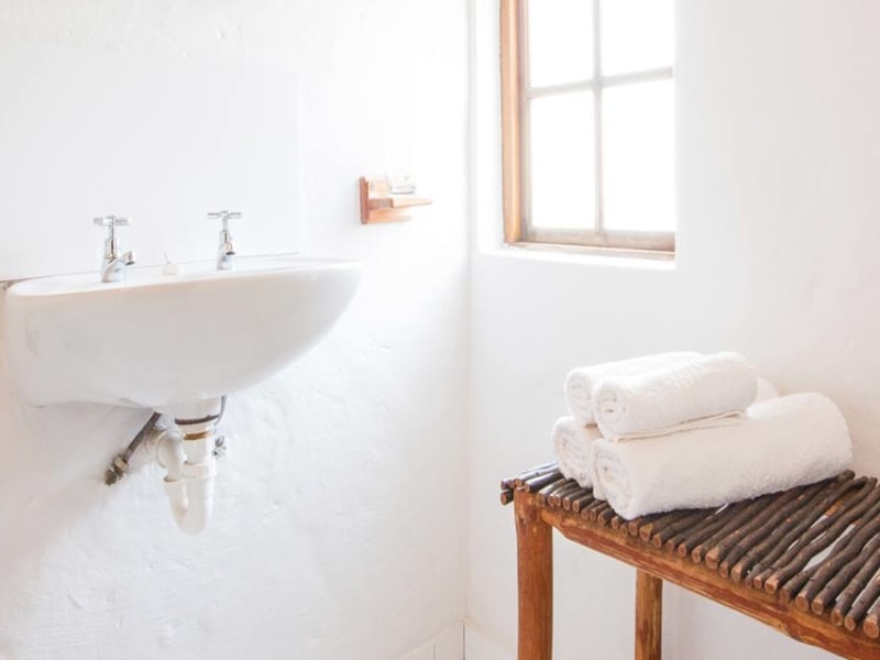 Bathroom basin with fresh towels