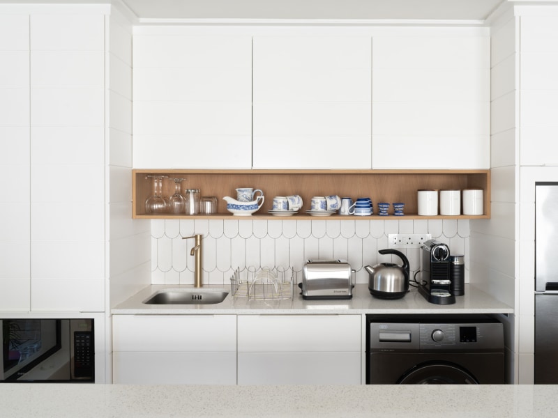 Kitchen run with washing machine, Nespresso, toaster and fridge