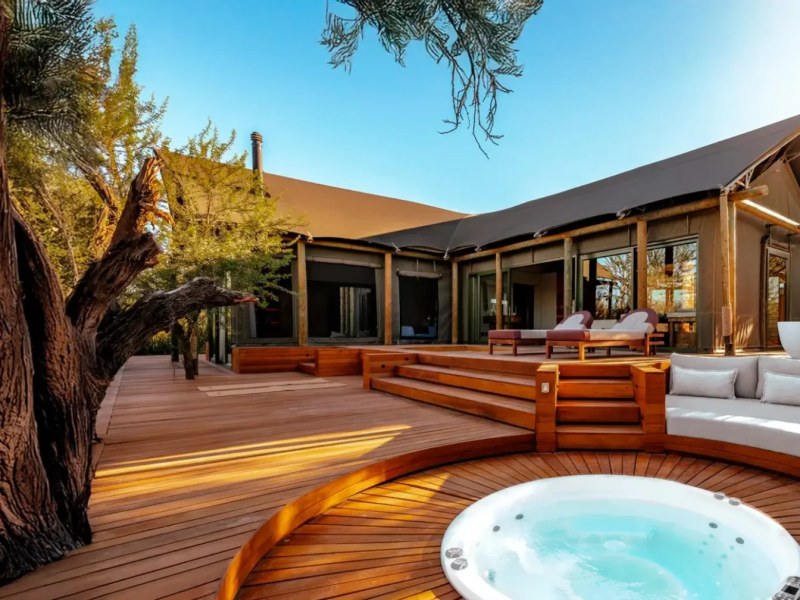A Kuganha tented suite with a private deck and hot tub in the Tankwa Karoo